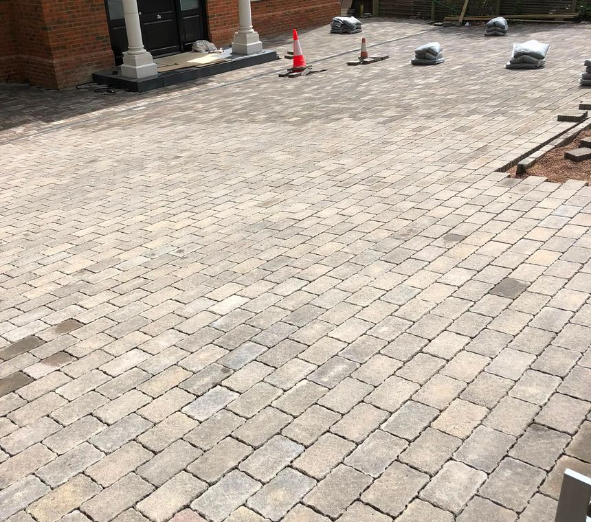 A newly laid block-paving driveway with a contrasting border